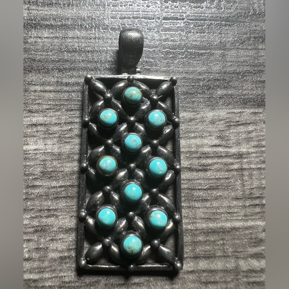 Stunning Turquoise sterling silver Zuni snake eye row Pendant